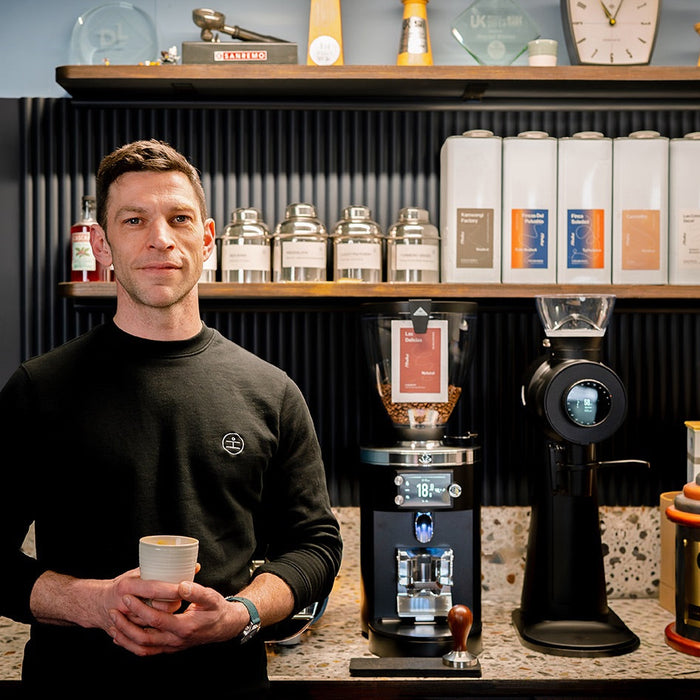 Dale Harris in coffee roastery with GbS grinder