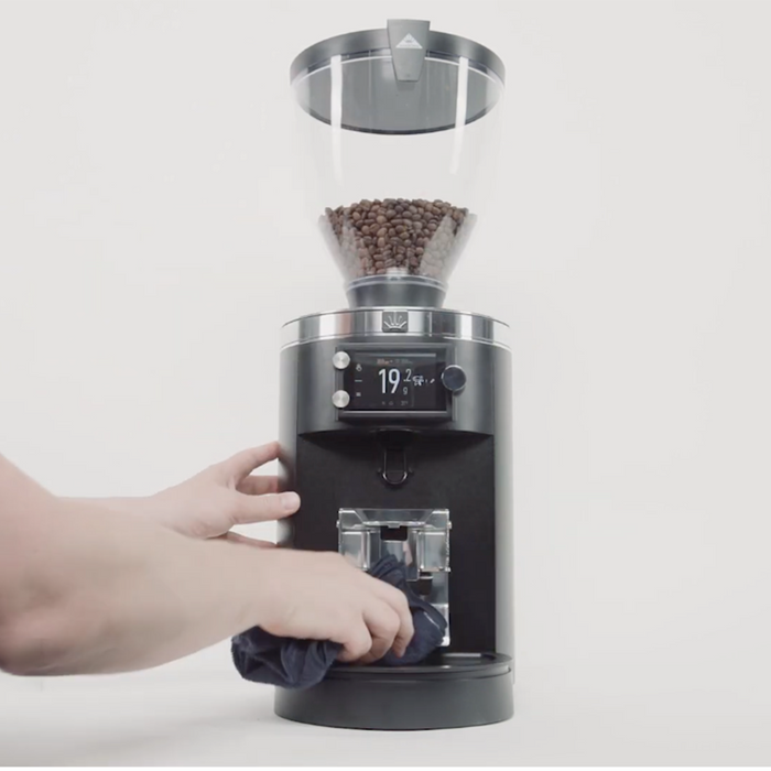 cleaning an espresso coffee grinder